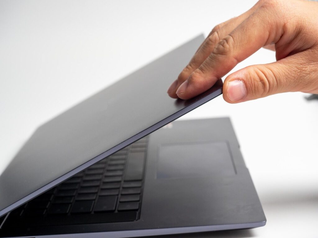 Closeup man s hand opening lid gray laptop modern devices work leisure 136344 3190